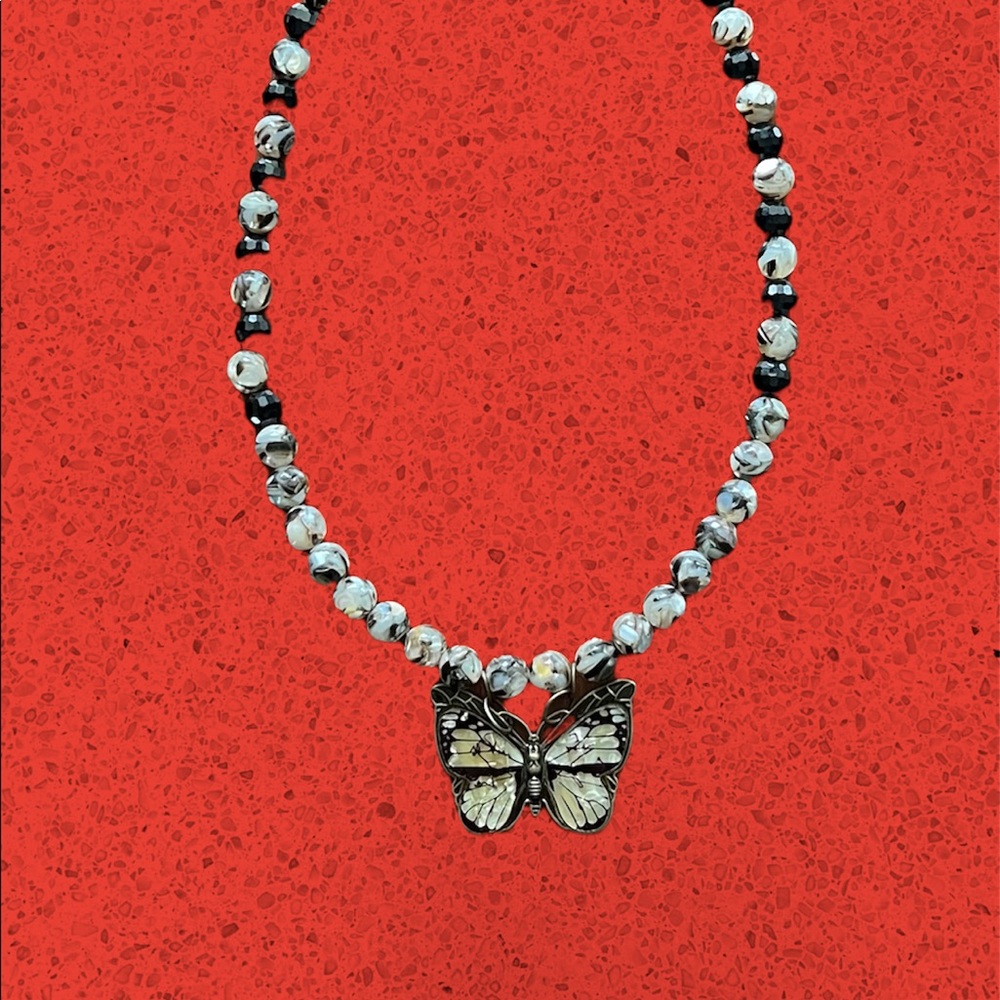 Handmade black and cream beaded necklace with butterfly
